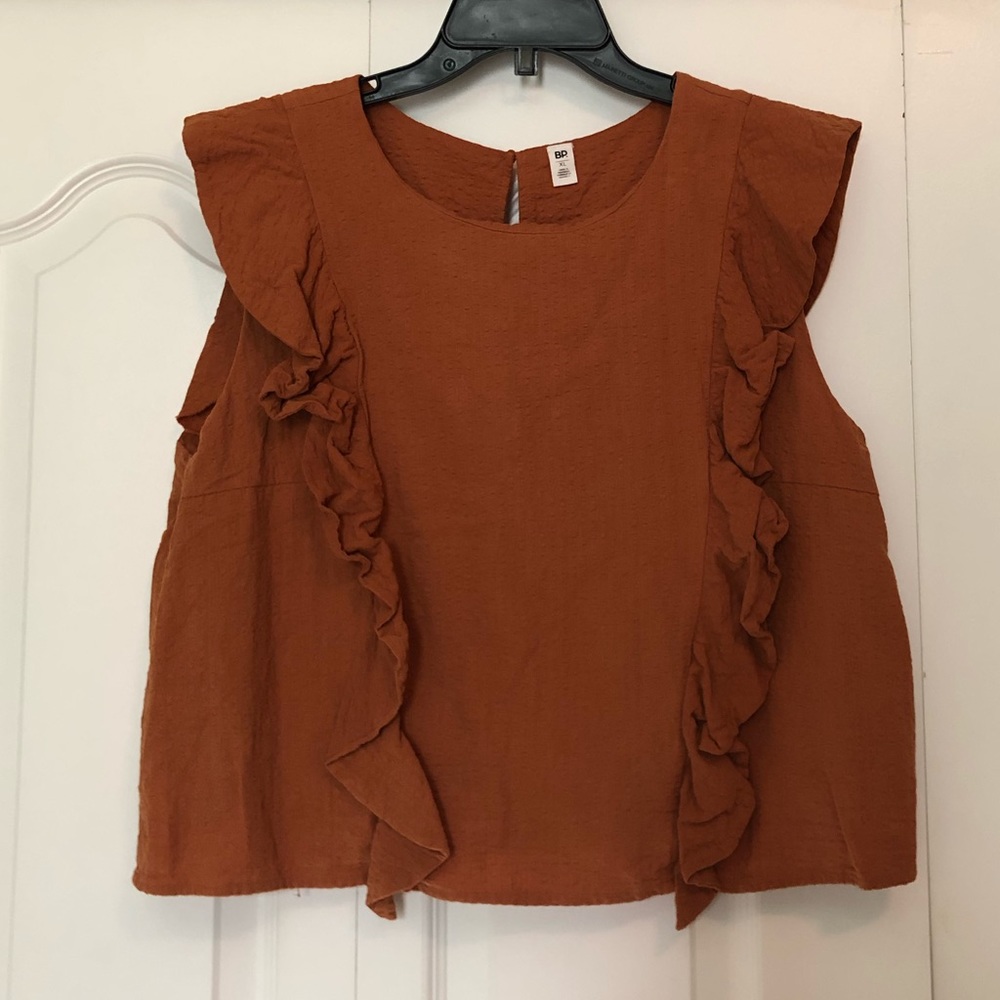 Ruffled sleeveless blouse